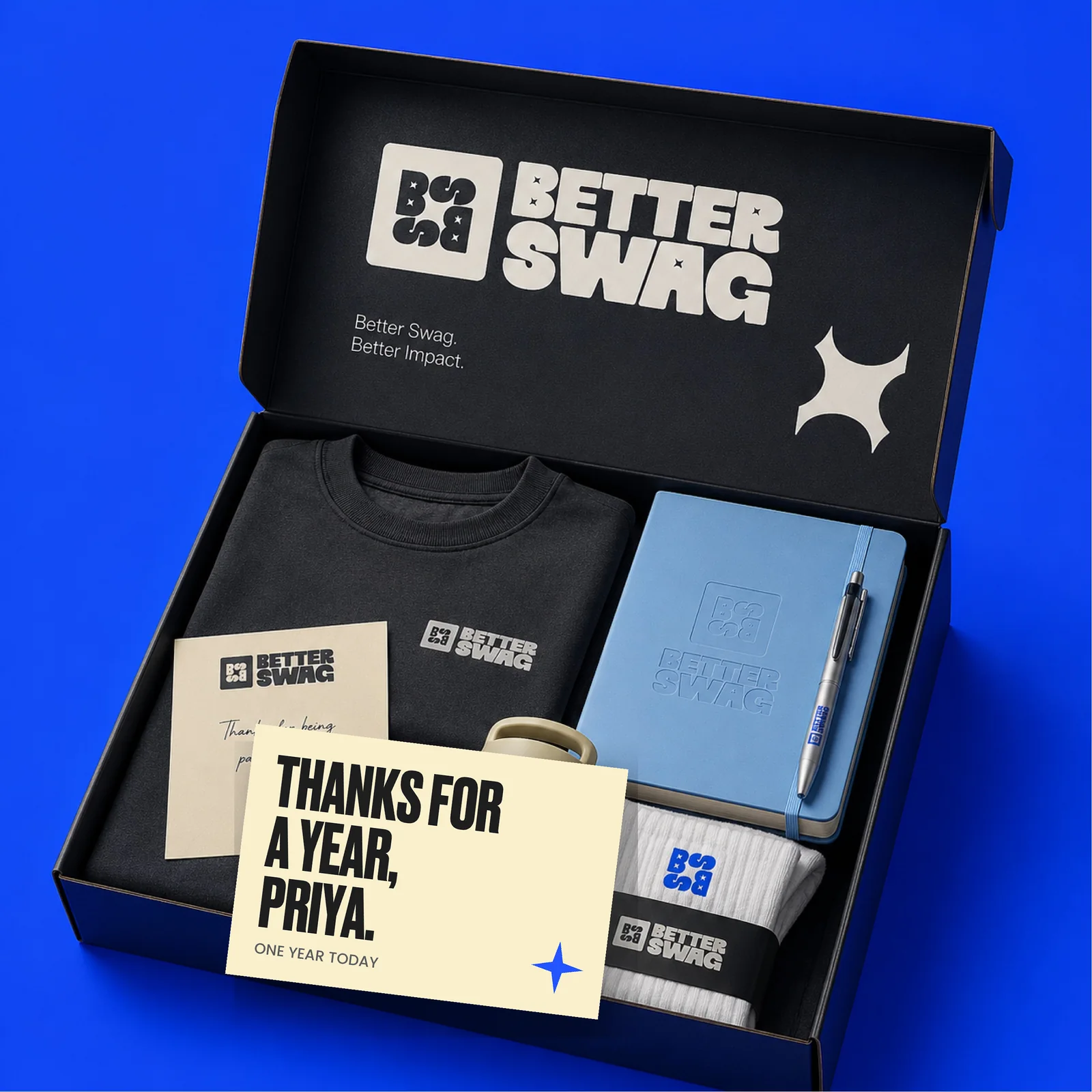 An open Better Swag gift box with a card that reads Thanks for a year, Priya